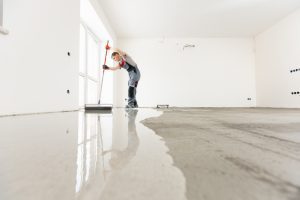 Leveling,With,Mixture,Of,Cement,For,Floors.,Worker,Use,Screed